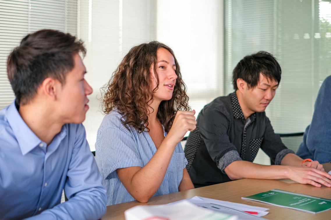 Staff and students meeting in the office